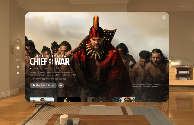 The Apple TV experience of Apple Vision Pro is displayed in a living room, with a still image from the Apple TV+ series Chief of War