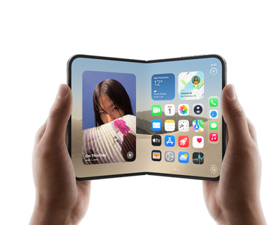 Two hands hold an open iPhone Duo, left screen displays a photo of a woman, right screen shows a home screen with various app icons, including Messages, Photos, Camera, and App Store