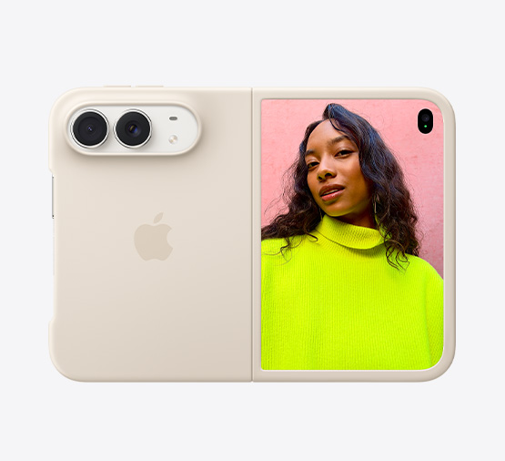 iPhone Duo, สีสตาร์ไวท์, วางอยู่บน Folio พร้อมขาตั้งสีนาวีบลู, กางเปิดในแนวนอนจนสุด, ภายนอกด้านหลังแสดงกล้องหลัง Dual Fusion 48MP, เลนส์ 2 ตัว