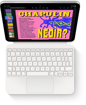 iPad ve beyaz renkte Magic Keyboard Folio’nun tepeden görünümü.