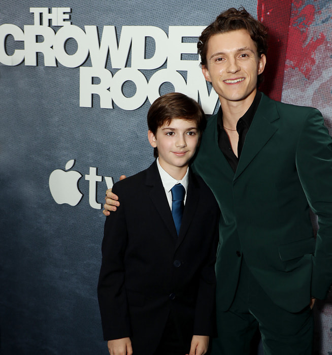 Zachary Golinger and Tom Holland at the “The Crowded Room” premiere