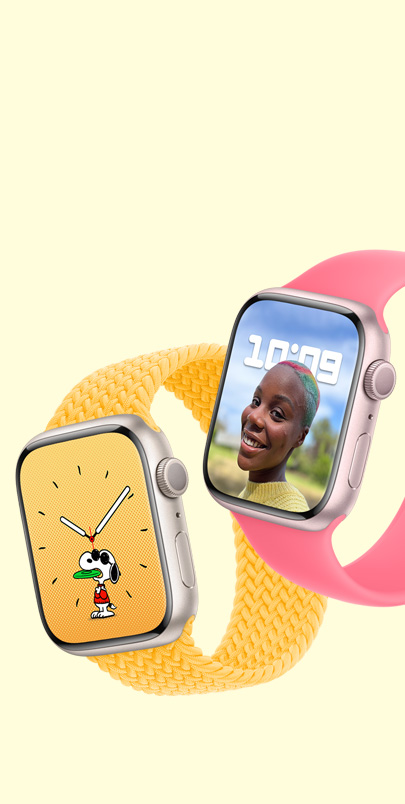 Два пристрої Apple Watch Series 9. У першого — циферблат зі Снупі та плетений монобраслет у кольорі «сонячне світло». У другого — циферблат з портретом та монобраслет рожевого кольору.