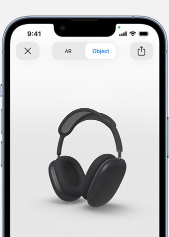 Kosminių pilkų „AirPods Max“ „iPhone“ papildytosios realybės ekrane vaizdas.