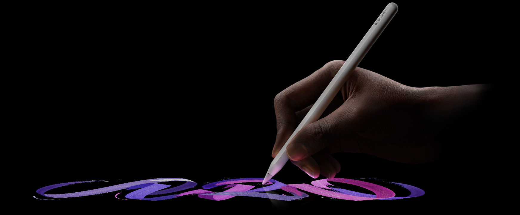 User holding Apple Pencil Pro, a vibrant brush line is following