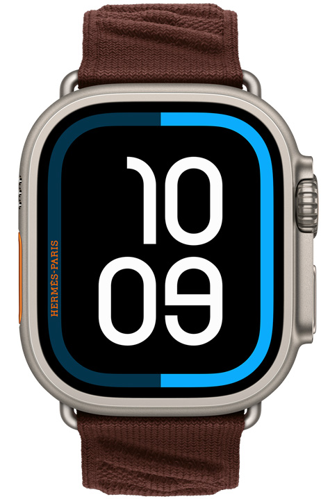 Apple Watch Hermès Ultra 4, Maritime digital watch face, titanium case, natural colour, right side exterior, Digital Crown, raised side button, paired with En Mer strap, Bordeaux colour (dark brown), textured knit material