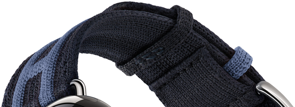 Apple Watch Hermès Series 12 Rocabar Club strap detail, Bleu Nuit/Bleu Brighton colour, dark blue knit material with light blue raised striped design that incorporates the Hermès H