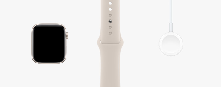Dispostos lado a lado: vista frontal do hardware do Apple Watch SE, bracelete desportiva luz das estrelas e cabo de carregamento magnético para USB‑C.
