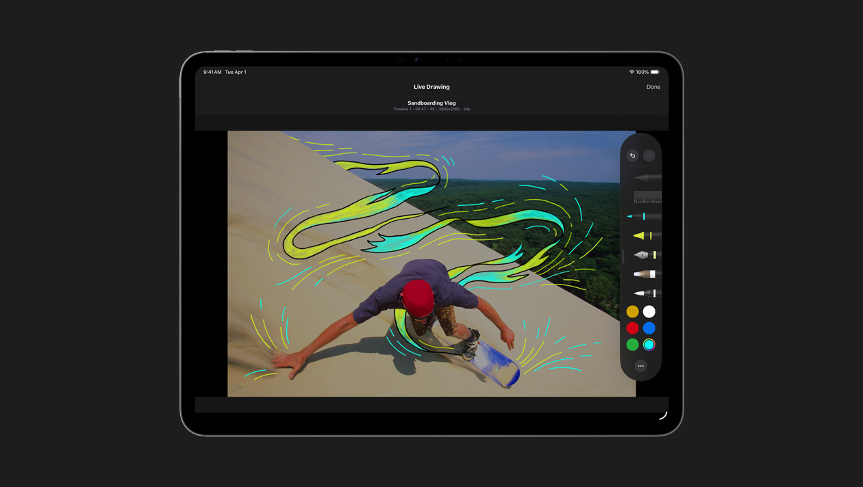 iPad Pro 13, um skatista em dunas de areia com linhas de movimento amarelas e azuis ao redor dele, demonstração do Desenho ao Vivo