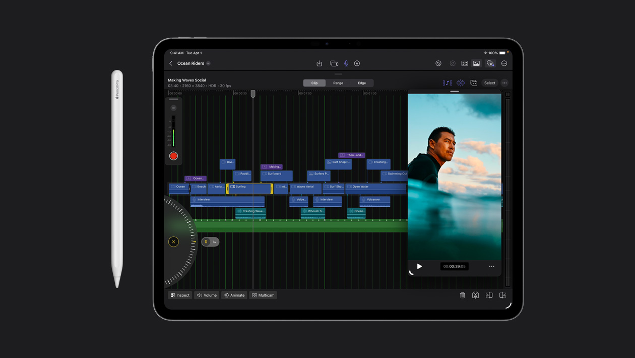 A tela do iPad Pro de 13 polegadas mostra clipes de vídeo organizados em diferentes cores, imagem de uma pessoa surfando no mar à direita, Apple Pencil à esquerda do aparelho