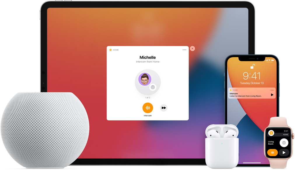 White HomePod mini, an iPad, AirPods in a case, an iPhone, and an Apple Watch with a pink band are arranged.