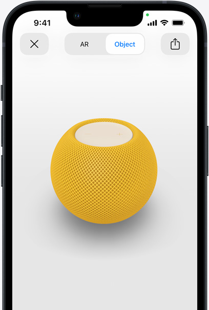 Yellow HomePod on the screen of an iPhone in AR view.