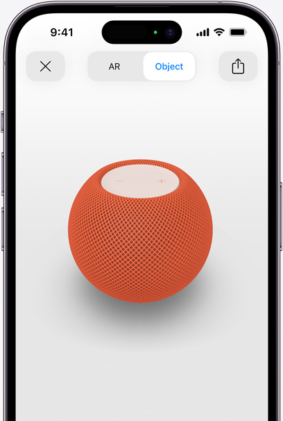 HomePod i oransje vist i utvidet virkelighet på en iPhone-skjerm.