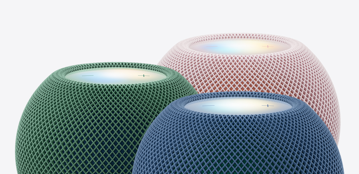 Tres bocinas HomePod mini 2, color verde, color azul, color rosa, primer plano de la parte superior, malla acústica tejida, superficies táctiles iluminadas