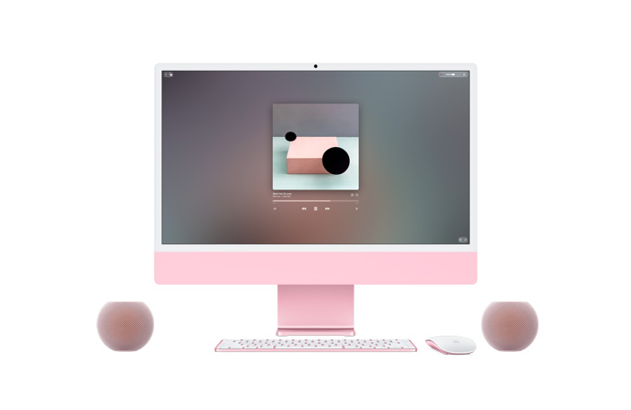 Pinkki iMac, etupuoli, näytöllä toistetaan Apple Musicia, sävy sävyyn sopivat Magic Keyboard ja Magic Mouse, vieressä kaksi pinkkiä HomePod mini 2 ‑kaiutinta stereoparina