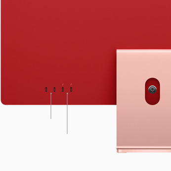 Krupni plan dva priključka Thunderbolt / USB 4 i dva priključka USB 3 na iMacu ružičaste boje