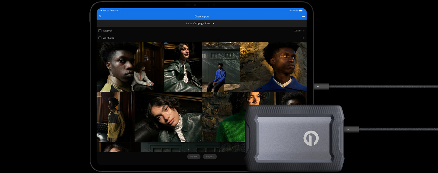 Vooraanzicht van iPad Pro in de kleur spacezwart, in horizontale stand, verbonden met een kabel met een externe USB‑C-harddrive, op het display worden foto’s van modellen geïmporteerd naar een map met de naam ‘Campaign Shoot’