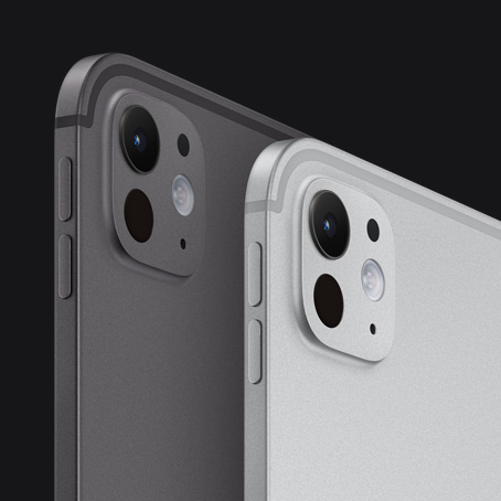 Dos iPad Pro, parte trasera y lateral exterior, posición vertical, color negro espacial y color plata, botones para subir y bajar el volumen y el sistema de cámara pro