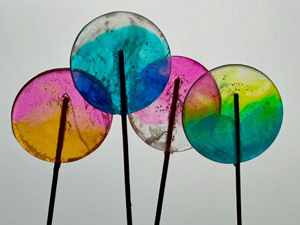 A close-up photo of colorful lollipops. The shot was taken with the 3x Telephoto camera.