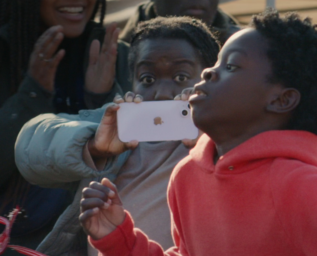 A still-life shot of a parent using Action mode to capture her son's school sports race.