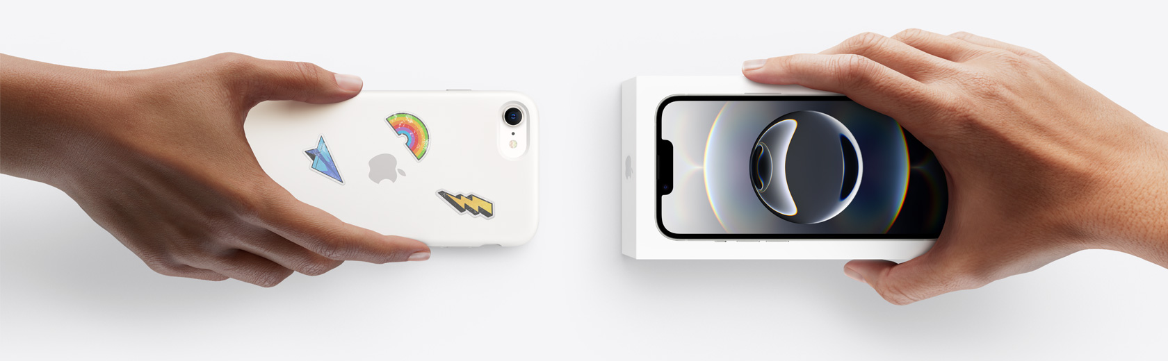 Hands exchanging trade-in smartphone for iPhone 16e in box.