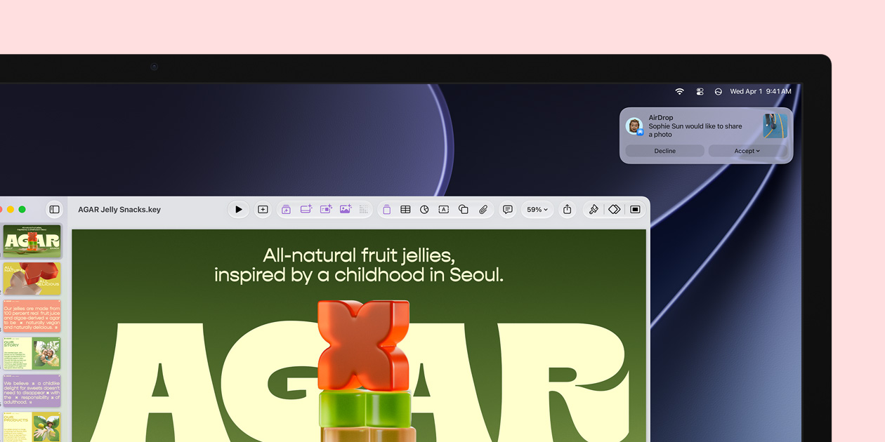 Studio Display screen showcases a Keynote about jelly snacks, a notification in the upper-right corner of the screen shows a request from another person to share a photo
