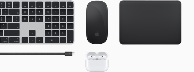 Collection of accessories including Magic&nbsp;Keyboard with Touch&nbsp;ID, Magic&nbsp;Mouse, Magic&nbsp;Track&nbsp;Pad, Thunderbolt&nbsp;5 Pro cable and AirPods&nbsp;Pro