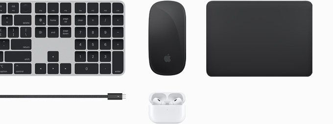 Collection of accessories including Magic Keyboard, Magic Mouse, Magic Track Pad, Thunderbolt 4 Pro cable and AirPods Pro.