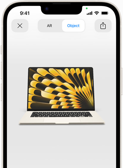 Preview of MacBook Air in Starlight color being viewed in AR experience on iPhone