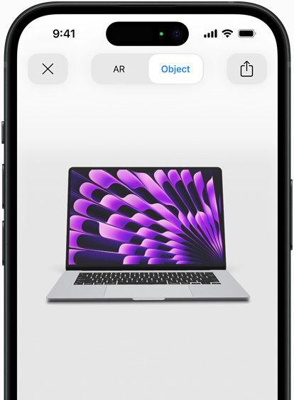 En forhåndstitt på MacBook Air i stellargrå, vist i utvidet virkelighet på en iPhone