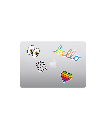 閉合的銀色 MacBook Air 機身俯視圖，色彩繽紛的貼紙圍繞著 Apple 標誌