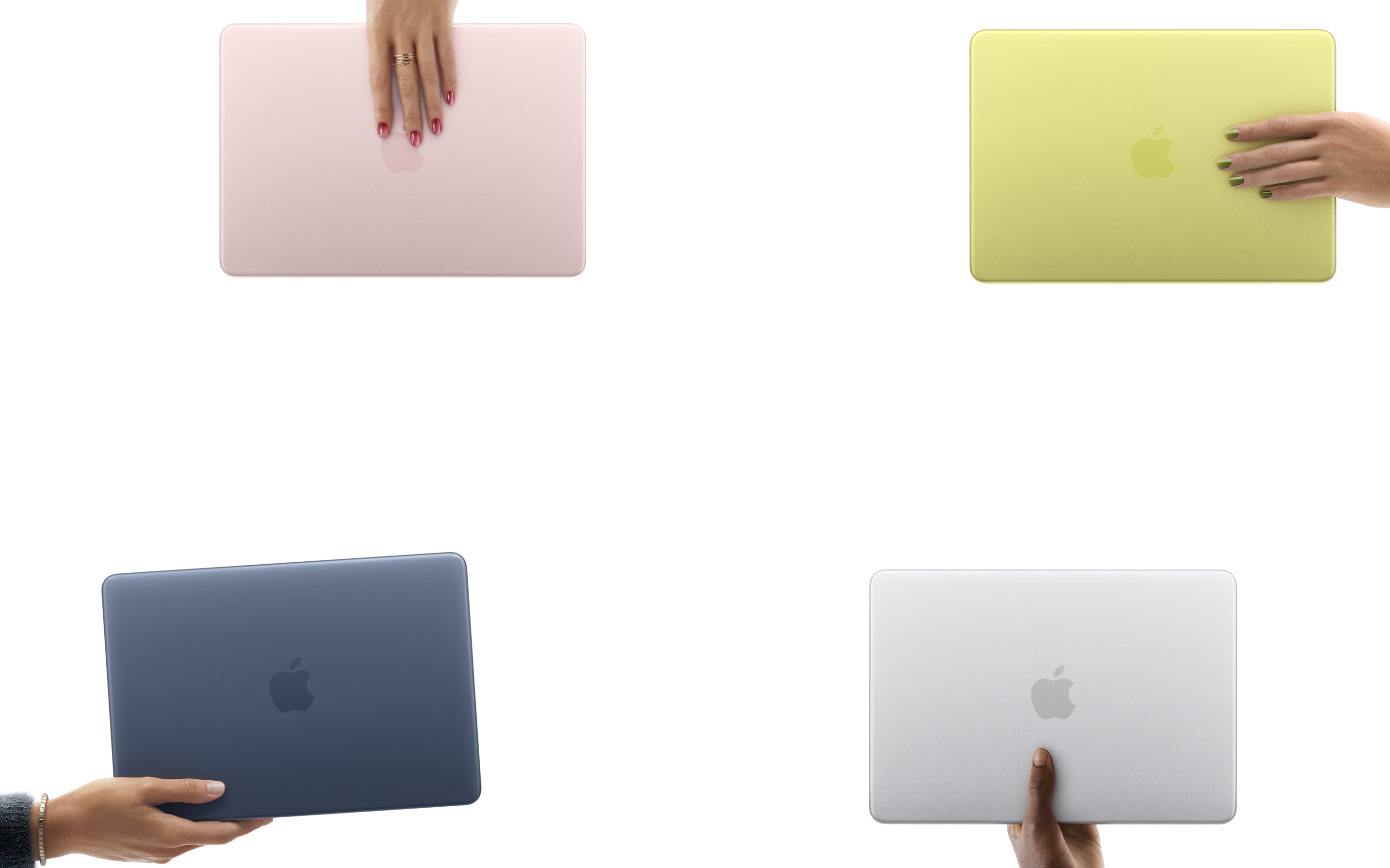 MacBook Neo laptops in various colors, each held in a different person's hand