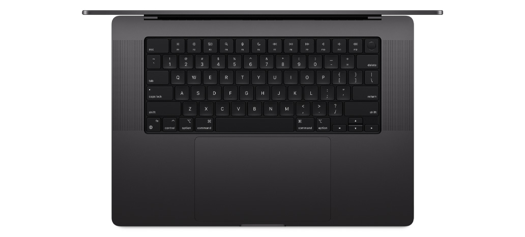 Vista de cima para baixo de um MacBook Pro a mostrar o Magic Keyboard integrado com Touch ID e trackpad