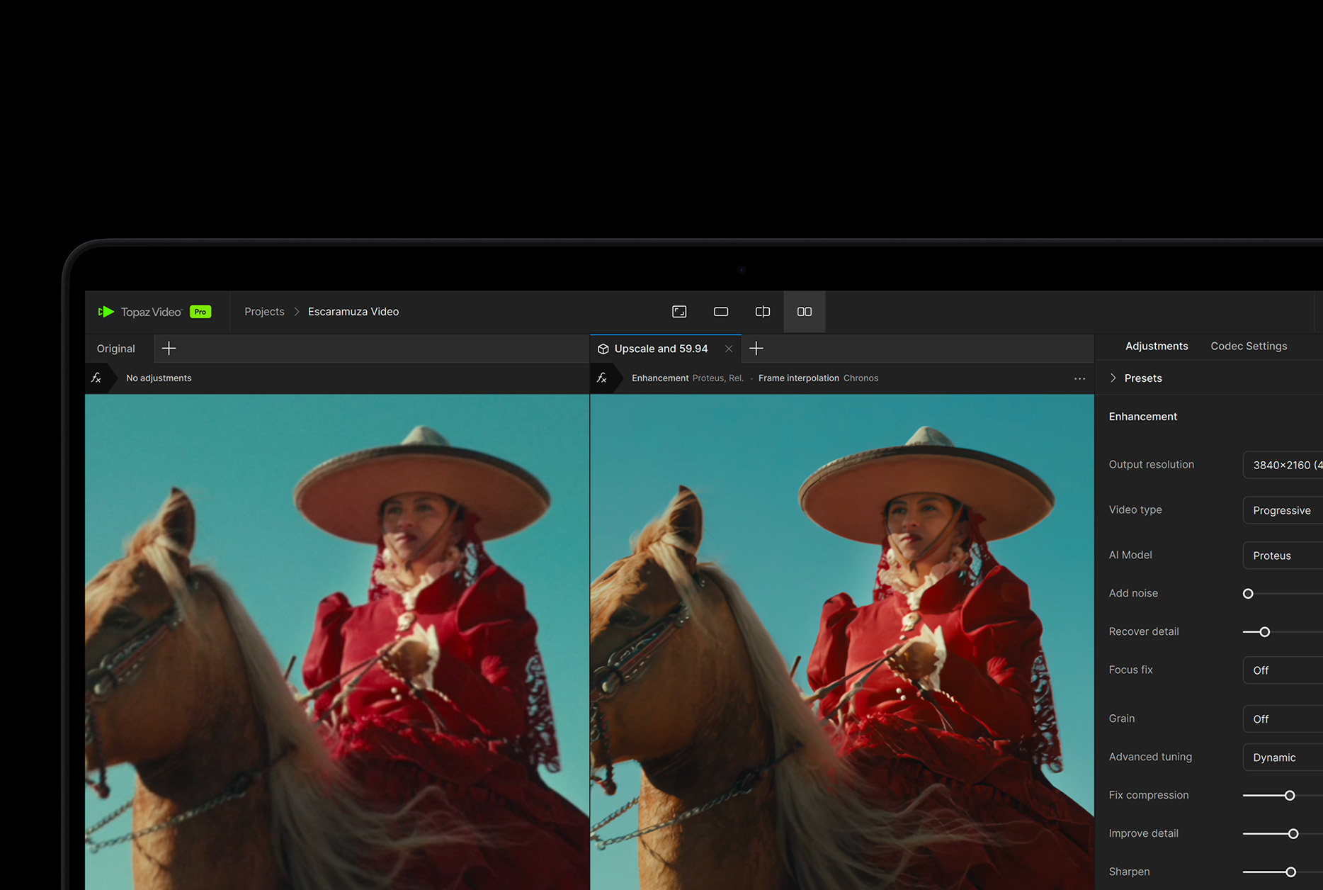 A MacBook Pro screen showing a video getting enhanced with AI in Topaz Video