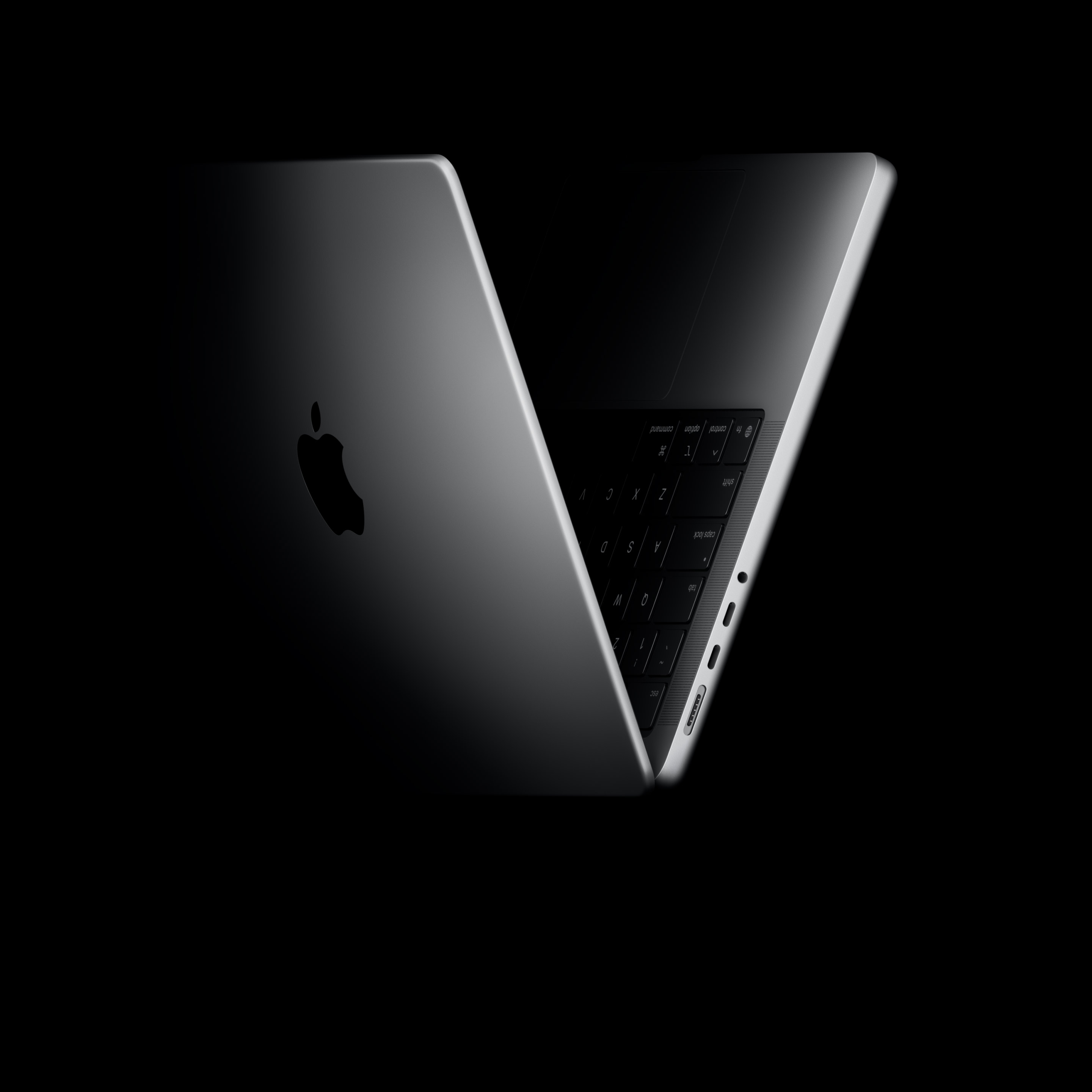 MacBook Pro positioned into the shape of a V, referencing the M5 chip