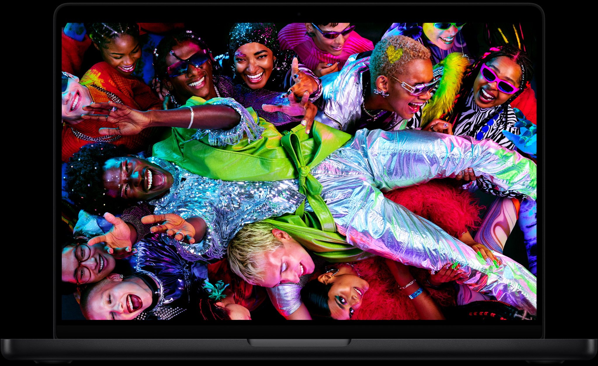 Colorful screen on a MacBook Pro of a person crowd-surfing at a party, showcasing the vibrant Liquid Retina XDR display