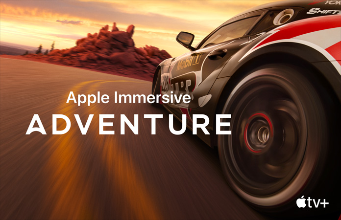 「Apple Immersive Adventure」という白いテキストを重ねたレーシングカー