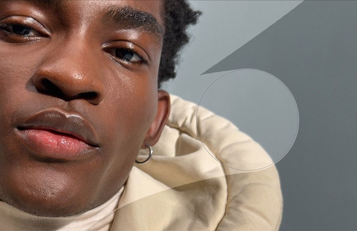 Close-up photo of a man's face, retouching tools