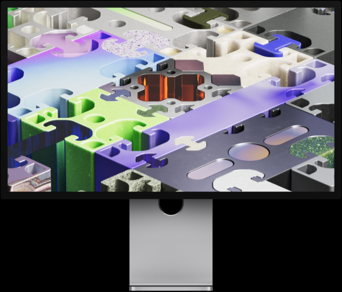 Voorkant van Studio Display XDR met driedimensionale puzzelachtige achtergrond