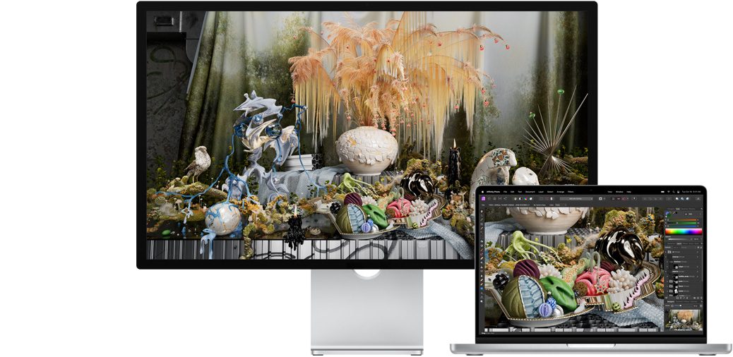 nEkranında Affinity Photo uygulamasındaki bir proje gösterilen Studio Display ve 14 inç MacBook Pro.